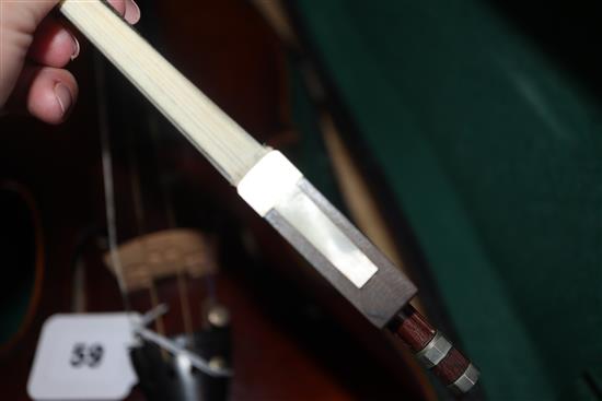 A German Strad style violin and a small violin and two bows